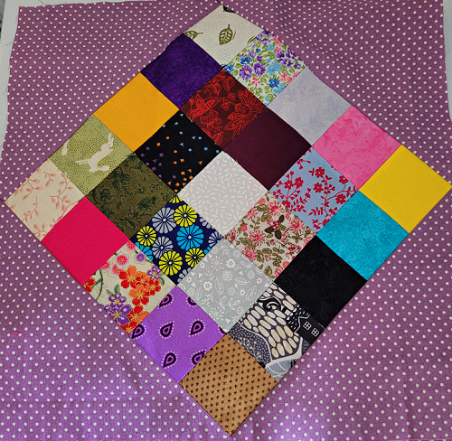 Perfect Seams Every Time Picture is of a patchwork sample using small fabric pieces set on point with fabric triangles to form a square